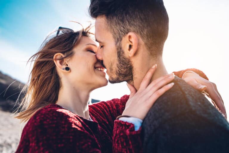 Up of a couple about to kiss, highlighting intimacy and emotional connection.