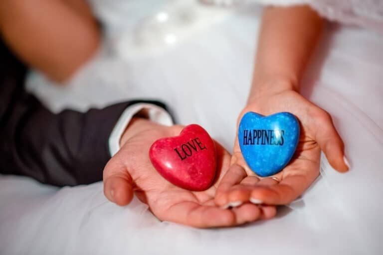 Love and happiness hearts in hands, symbolizing connection and positive emotions for HIV dating site.